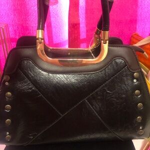 Black Leather Bag with Gold-Toned Handles and Edgy Studs